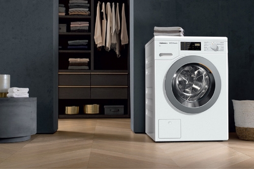 Miele washing machine and appliances in a bright utility room
